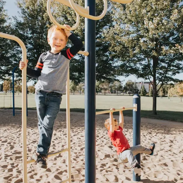 A family enjoying time at an amusement park with benefit cards
