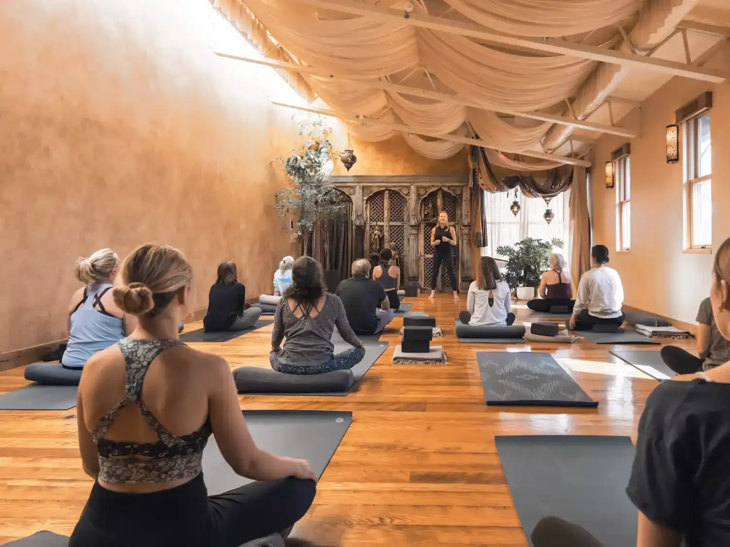 A woman doing yoga in a modern studio